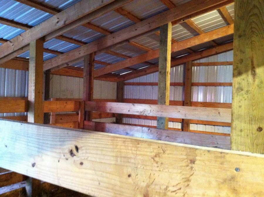 Interior of building with wood stud walls and metal siding